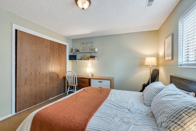 161 E 700 N Unit 10, Provo, UT 84606 - carpeted bedroom with a closet, a textured ceiling, and visible vents