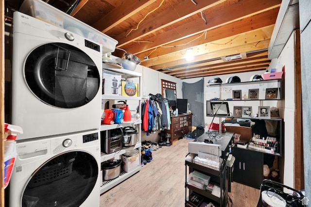 7979 W 3320 S, Magna, UT 84044 - laundry room featuring laundry area, stacked washer and dryer, and wood finished floors