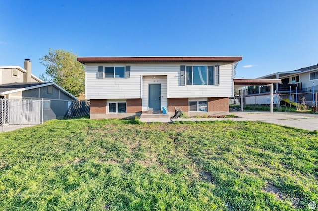 7979 W 3320 S, Magna, UT 84044 - bi-level home featuring fence, a carport, and brick siding