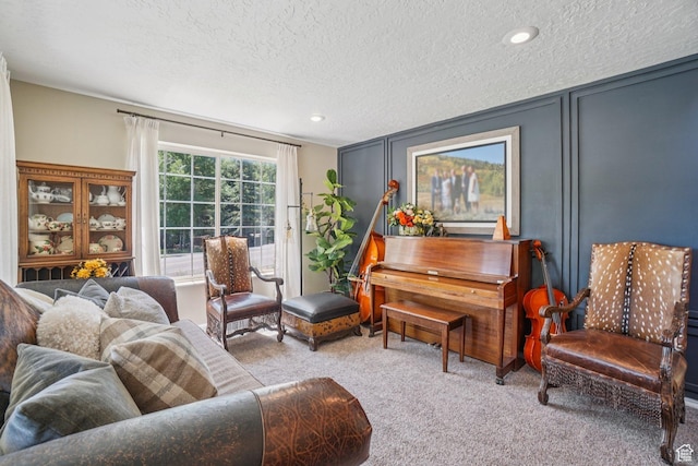 8030 N Springshire Dr, Park City, UT 84098 - carpeted living area featuring a textured ceiling, recessed lighting, and a decorative wall