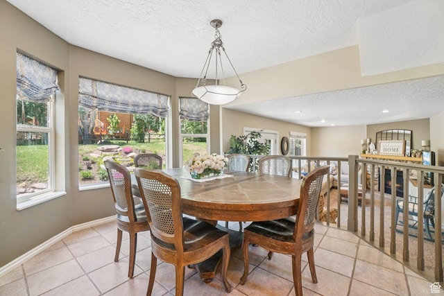 8030 N Springshire Dr, Park City, UT 84098 - dining space with a textured ceiling, healthy amount of natural light, light tile patterned flooring, and recessed lighting