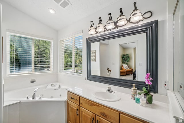 8030 N Springshire Dr, Park City, UT 84098 - full bathroom with vaulted ceiling, vanity, a tub with jets, and a textured ceiling