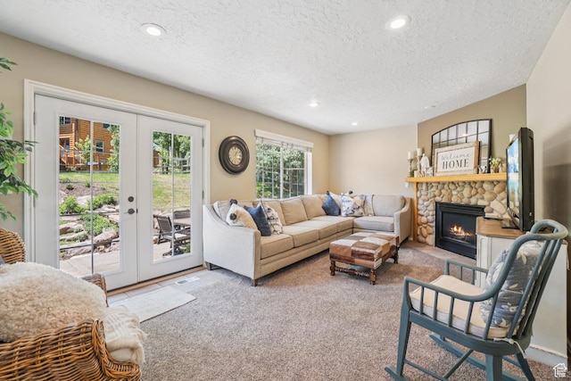 8030 N Springshire Dr, Park City, UT 84098 - carpeted living area featuring a textured ceiling, french doors, a fireplace, and recessed lighting