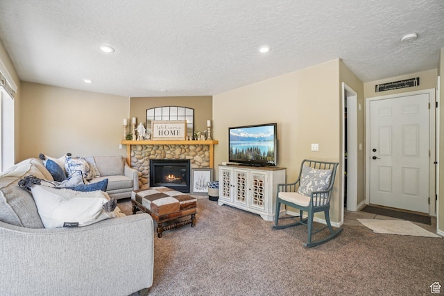 8030 N Springshire Dr, Park City, UT 84098 - carpeted living area featuring a stone fireplace, a textured ceiling, and recessed lighting