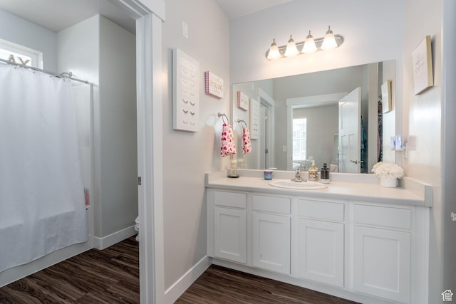 1809 W Terra Vista Ln Unit H101, Saratoga Springs, UT 84045 - full bath featuring vanity, wood finished floors, a wealth of natural light, and a shower with curtain