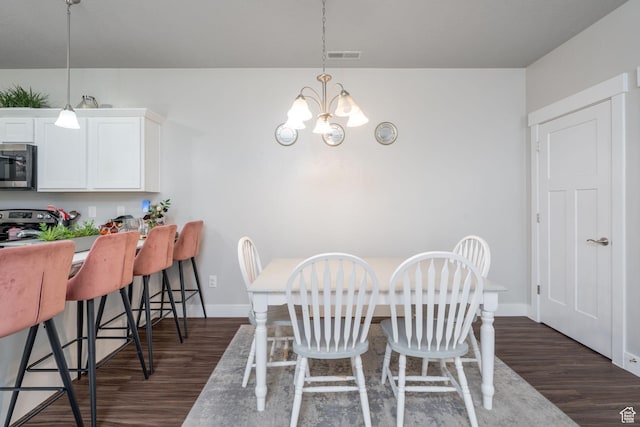 1809 W Terra Vista Ln Unit H101, Saratoga Springs, UT 84045 - dining space with baseboards, visible vents, a notable chandelier, and dark wood-type flooring