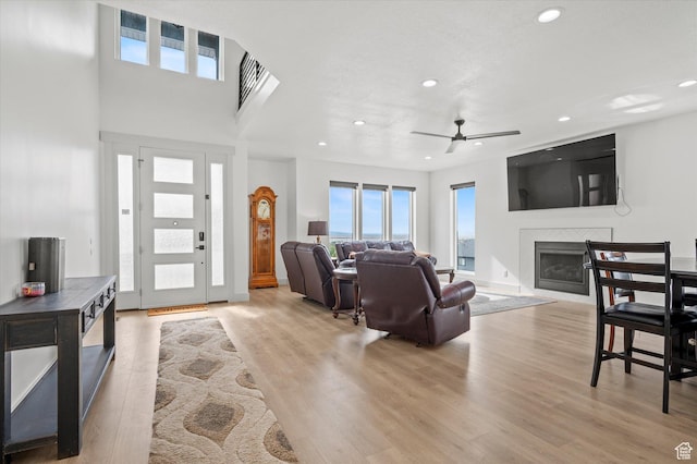 833 S 260 E, Willard, UT 84340 - living room with recessed lighting, a glass covered fireplace, wood finished floors, and ceiling fan