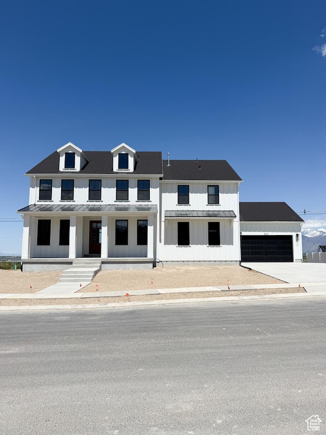 302 W Horizon View Loop Unit 35, Elk Ridge, UT 84651 - view of front of property with covered porch, a standing seam roof, board and batten siding, metal roof, and an attached garage
