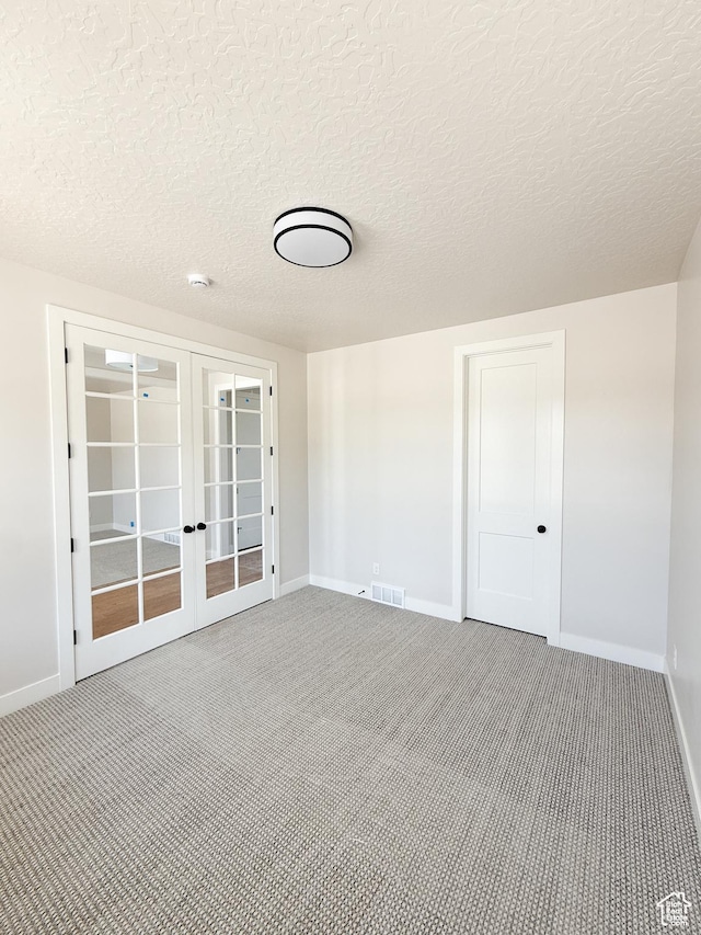 302 W Horizon View Loop Unit 35, Elk Ridge, UT 84651 - carpeted spare room featuring baseboards, french doors, and a textured ceiling