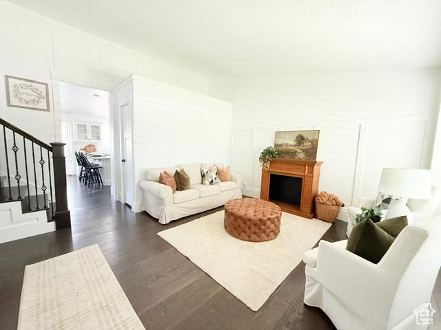 1170 N Main St, Orem, UT 84057 - living room featuring stairway and dark wood-style flooring