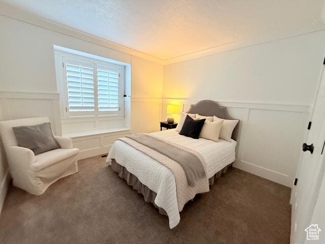 1170 N Main St, Orem, UT 84057 - bedroom with wainscoting, carpet, and a decorative wall