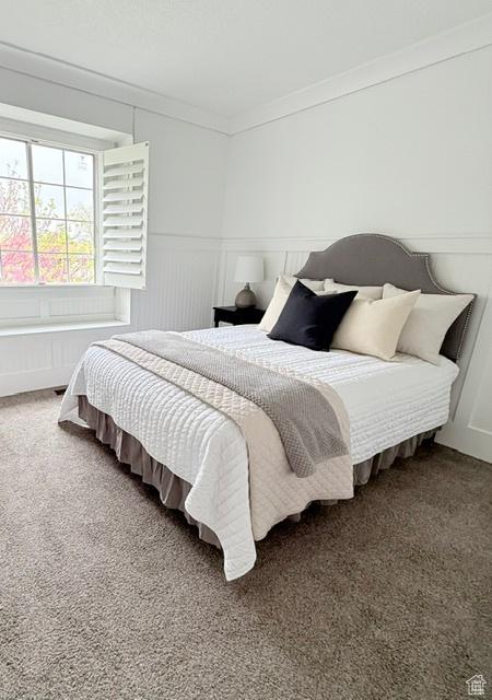 1170 N Main St, Orem, UT 84057 - bedroom featuring crown molding, carpet flooring, and a decorative wall