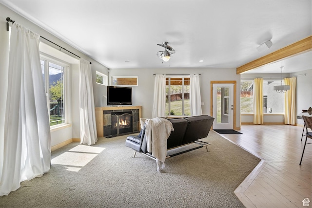 933 N Swiss Farm Ct, Midway, UT 84049 - living area with wood finished floors, a fireplace, beamed ceiling, baseboards, and recessed lighting