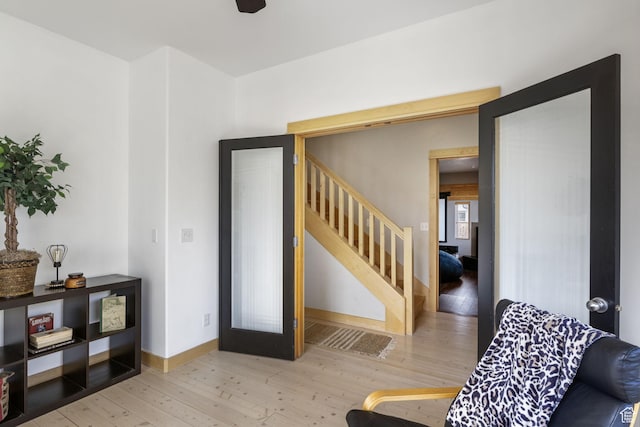 933 N Swiss Farm Ct, Midway, UT 84049 - living room featuring stairway, baseboards, and wood finished floors