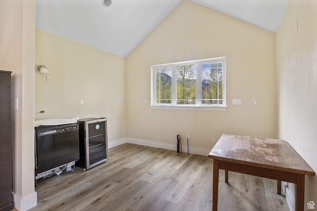 933 N Swiss Farm Ct, Midway, UT 84049 - unfurnished office featuring baseboards, light wood finished floors, wine cooler, and vaulted ceiling
