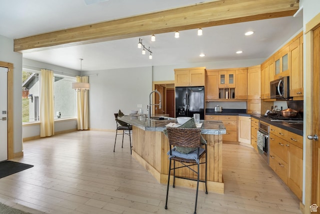 933 N Swiss Farm Ct, Midway, UT 84049 - kitchen with a sink, stainless steel appliances, a kitchen bar, beamed ceiling, and glass insert cabinets