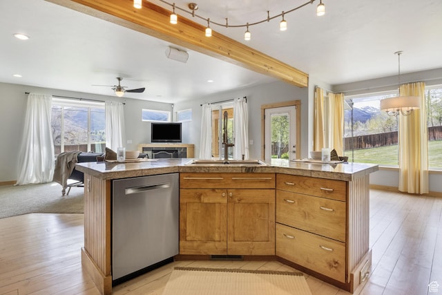 933 N Swiss Farm Ct, Midway, UT 84049 - kitchen featuring stainless steel dishwasher, light wood-type flooring, open floor plan, and a wealth of natural light