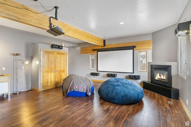 933 N Swiss Farm Ct, Midway, UT 84049 - home theater room featuring baseboards, beamed ceiling, a glass covered fireplace, recessed lighting, and hardwood / wood-style floors