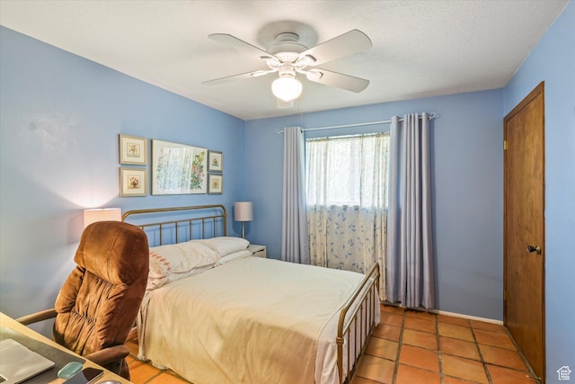 1597 E 8900 S, Paradise, UT 84328 - bedroom featuring ceiling fan, light tile patterned floors, and baseboards