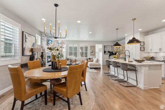 5346 W Canary Grass Way S, South Jordan, UT 84009 - dining space featuring recessed lighting, light wood finished floors, a chandelier, and baseboards