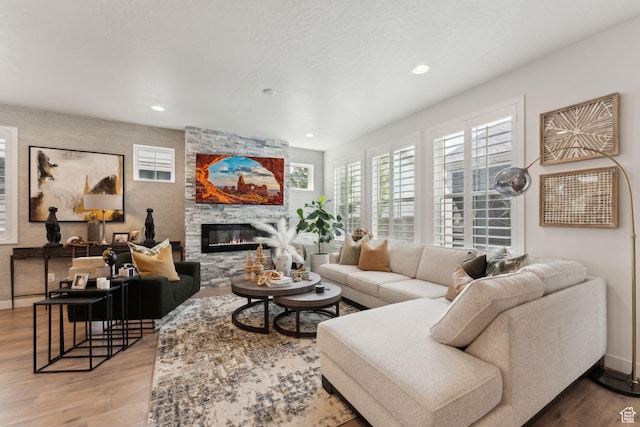 5346 W Canary Grass Way S, South Jordan, UT 84009 - living room featuring wood finished floors, a fireplace, and recessed lighting