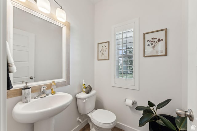 5346 W Canary Grass Way S, South Jordan, UT 84009 - bathroom with baseboards, toilet, and a sink