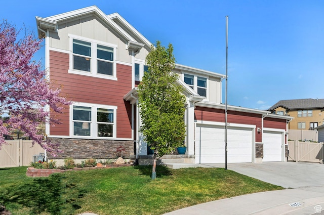 4852 N Arctic Fox Cir W Unit 2800, Lehi, UT 84043 - view of front of house with a front yard, a gate, fence, concrete driveway, and stone siding