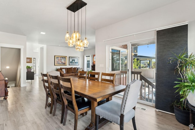 4852 N Arctic Fox Cir W Unit 2800, Lehi, UT 84043 - dining space with visible vents, light wood-style flooring, and an inviting chandelier