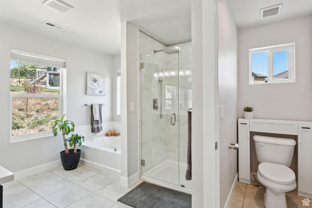 4852 N Arctic Fox Cir W Unit 2800, Lehi, UT 84043 - bathroom with a bath, visible vents, tile patterned flooring, a stall shower, and toilet