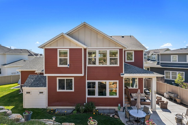 4852 N Arctic Fox Cir W Unit 2800, Lehi, UT 84043 - rear view of property featuring board and batten siding, a fenced backyard, a patio area, and an outdoor hangout area