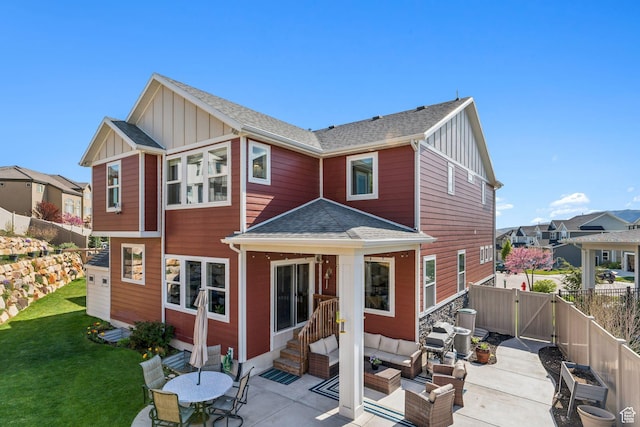 4852 N Arctic Fox Cir W Unit 2800, Lehi, UT 84043 - rear view of property featuring board and batten siding, an outdoor living space, and a patio area