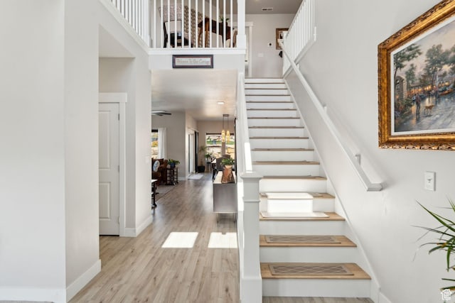 4852 N Arctic Fox Cir W Unit 2800, Lehi, UT 84043 - stairs featuring baseboards, visible vents, wood finished floors, and a towering ceiling
