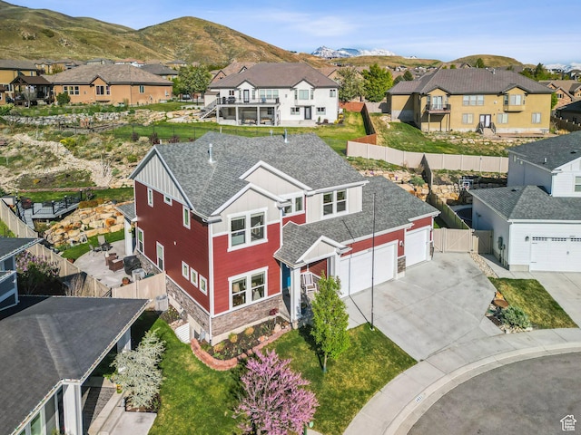 birds eye view of property featuring a residential view and a mountain view