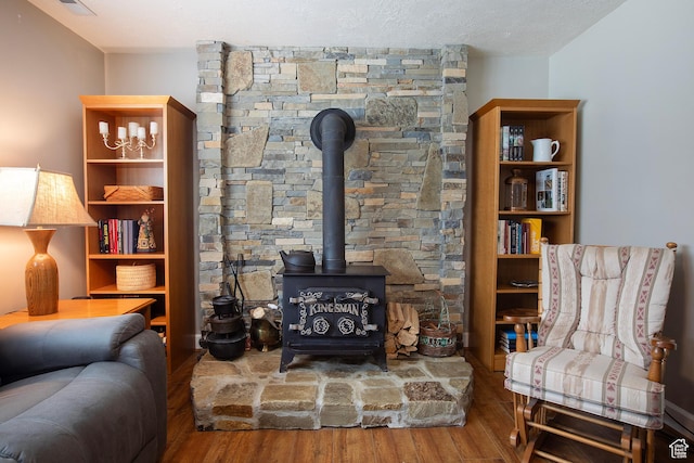 5716 S Maplewood Dr E, South Ogden, UT 84405 - living area with wood finished floors and a wood stove