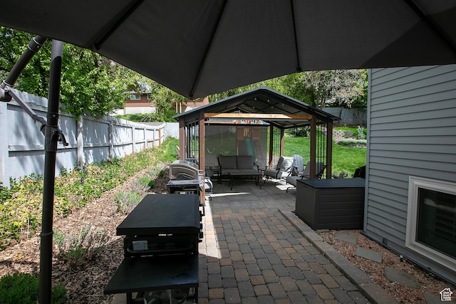 5716 S Maplewood Dr E, South Ogden, UT 84405 - view of patio / terrace featuring a gazebo, a fenced backyard, and outdoor lounge area