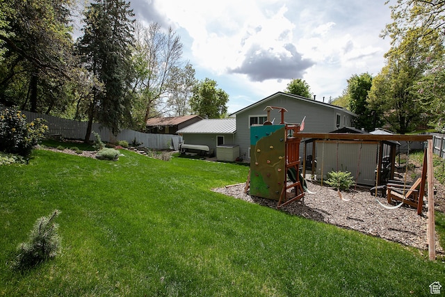 5716 S Maplewood Dr E, South Ogden, UT 84405 - view of yard featuring a playground and fence