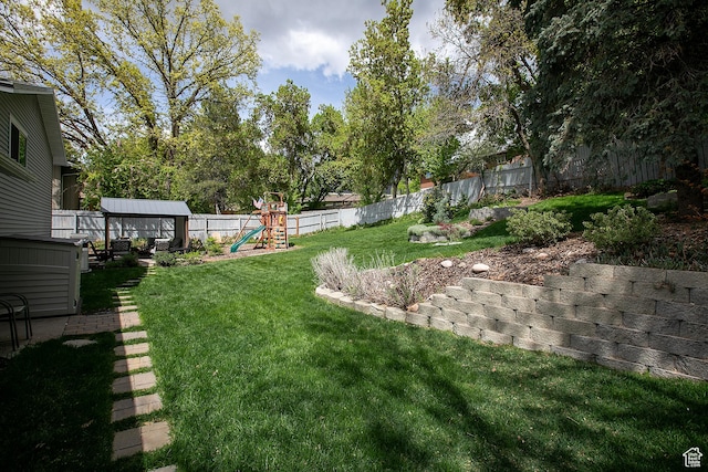 5716 S Maplewood Dr E, South Ogden, UT 84405 - view of yard with a fenced backyard and a playground