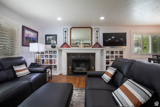 5716 S Maplewood Dr E, South Ogden, UT 84405 - living room with a high end fireplace, recessed lighting, and wood finished floors
