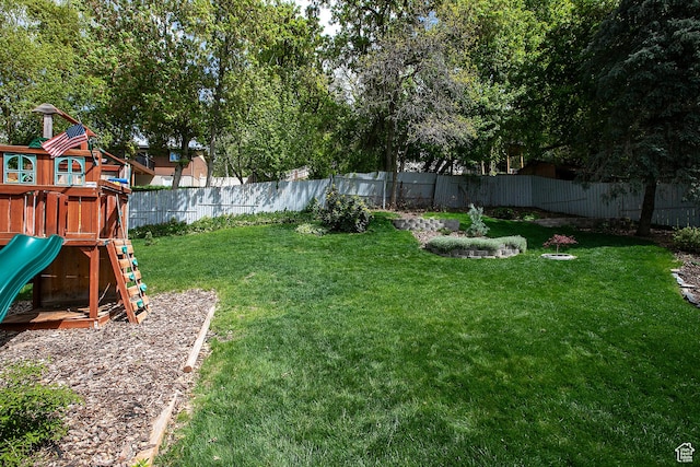 5716 S Maplewood Dr E, South Ogden, UT 84405 - view of yard with a playground and a fenced backyard