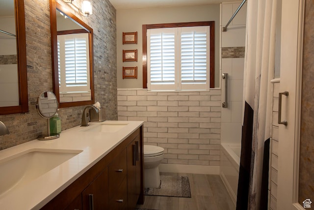 5716 S Maplewood Dr E, South Ogden, UT 84405 - full bathroom featuring toilet, tile walls, a sink, and shower / bath combo with shower curtain