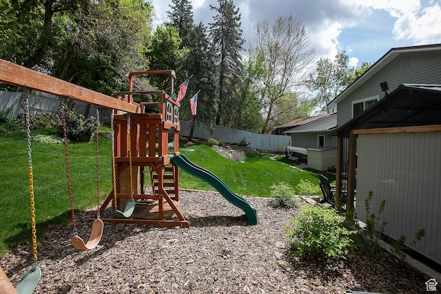 5716 S Maplewood Dr E, South Ogden, UT 84405 - view of play area with a fenced backyard and a yard