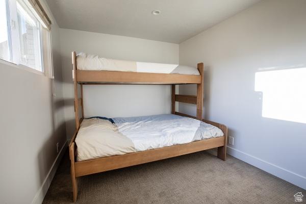 2812 E Commonwealth Ave S, Salt Lake City, UT 84109 - bedroom featuring carpet floors and baseboards