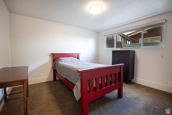 2812 E Commonwealth Ave S, Salt Lake City, UT 84109 - carpeted bedroom featuring baseboards