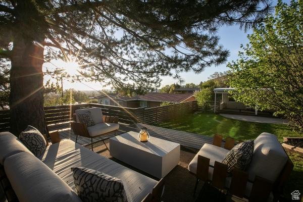 2812 E Commonwealth Ave S, Salt Lake City, UT 84109 - view of patio with an outdoor living space, a fenced backyard, and a wooden deck