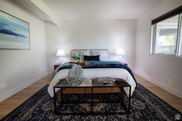 2812 E Commonwealth Ave S, Salt Lake City, UT 84109 - bedroom featuring baseboards and wood finished floors