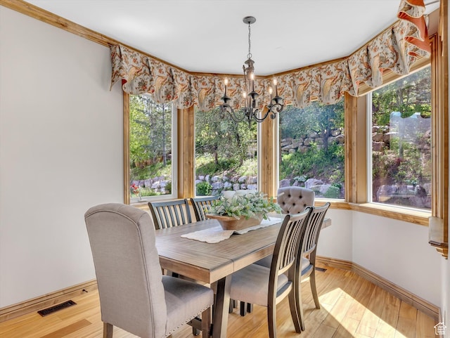 14099 S Pine Mesa Dr, Draper, UT 84020 - dining area with baseboards, visible vents, light wood finished floors, and a notable chandelier