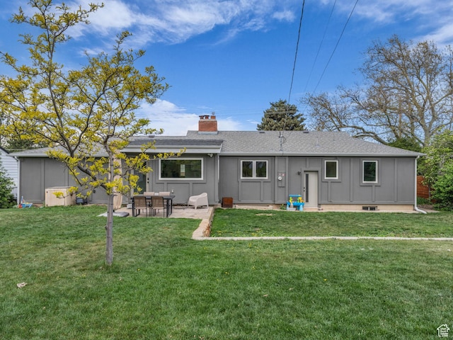 3133 S 2700 E, Millcreek, UT 84109 - back of property featuring roof with shingles, a patio, a chimney, and a yard
