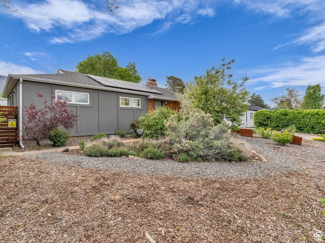 3133 S 2700 E, Millcreek, UT 84109 - view of side of home featuring solar panels and a chimney