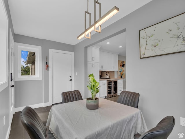 3133 S 2700 E, Millcreek, UT 84109 - dining space with dark tile patterned floors, baseboards, recessed lighting, and beverage cooler
