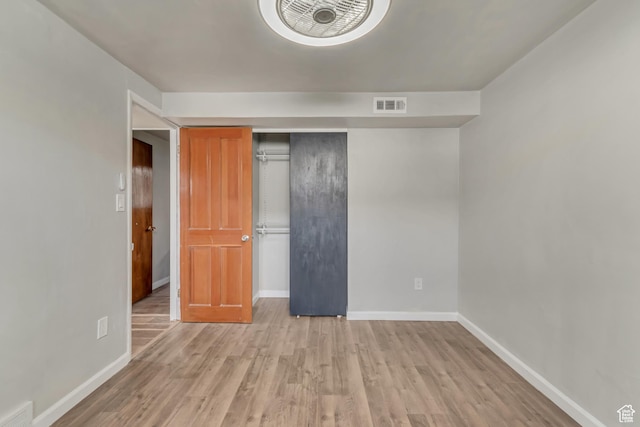 8729 S 3720 W, West Jordan, UT 84088 - unfurnished bedroom with baseboards, visible vents, and wood finished floors